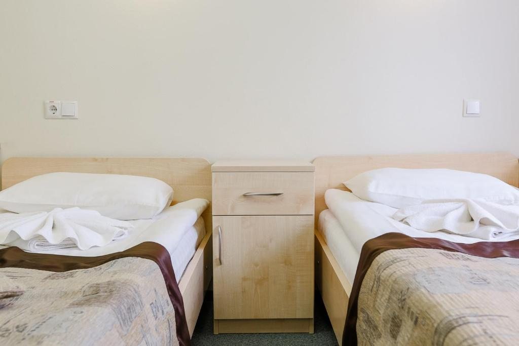 Двухместный (Двухместный номер с 2 отдельными кроватями - Подходит для гостей с ограниченными физическими возможностями) отеля Спорт-тайм, Минск