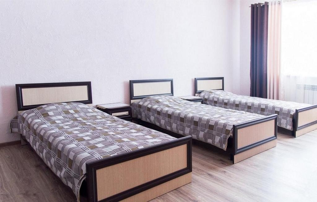 Четырехместный (Стандартный трехместный номер с дополнительной кроватью) гостевого дома ColiseuM, Витебск