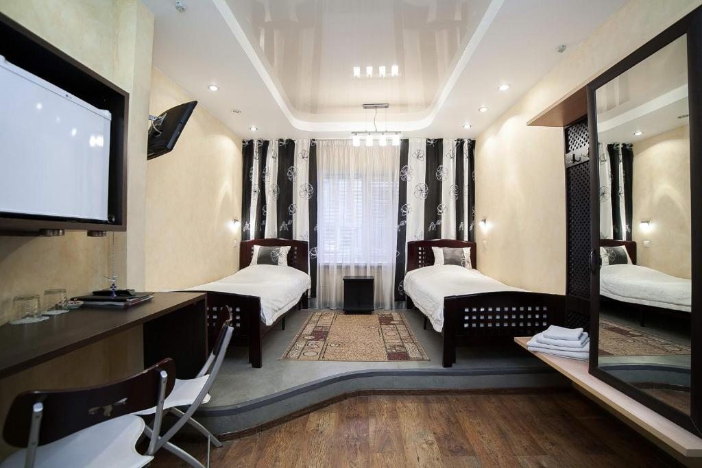 Двухместный (Улучшенный двухместный номер с 2 отдельными кроватями) мини-отеля Даниловская, Саратов