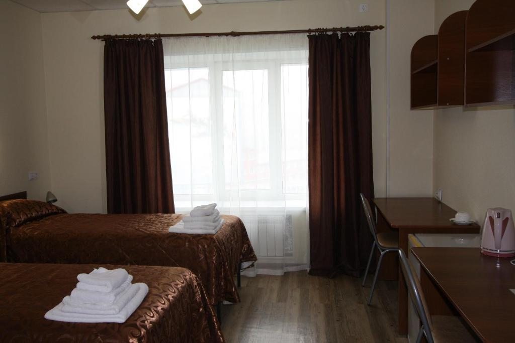 Двухместный (Стандартный двухместный номер с 2 отдельными кроватями) отеля Учебная 44, Владивосток