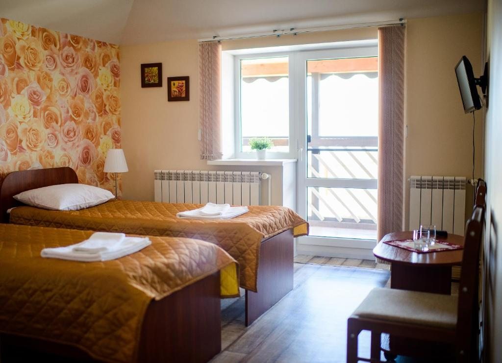 Двухместный (Стандартный двухместный номер с 2 отдельными кроватями) мотеля Вояж, Печоры, Псковская область