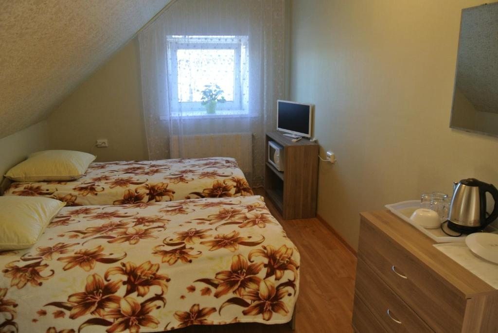Двухместный (Двухместный номер с 1 кроватью или 2 отдельными кроватями, общая ванная комната) отеля На Суздальской