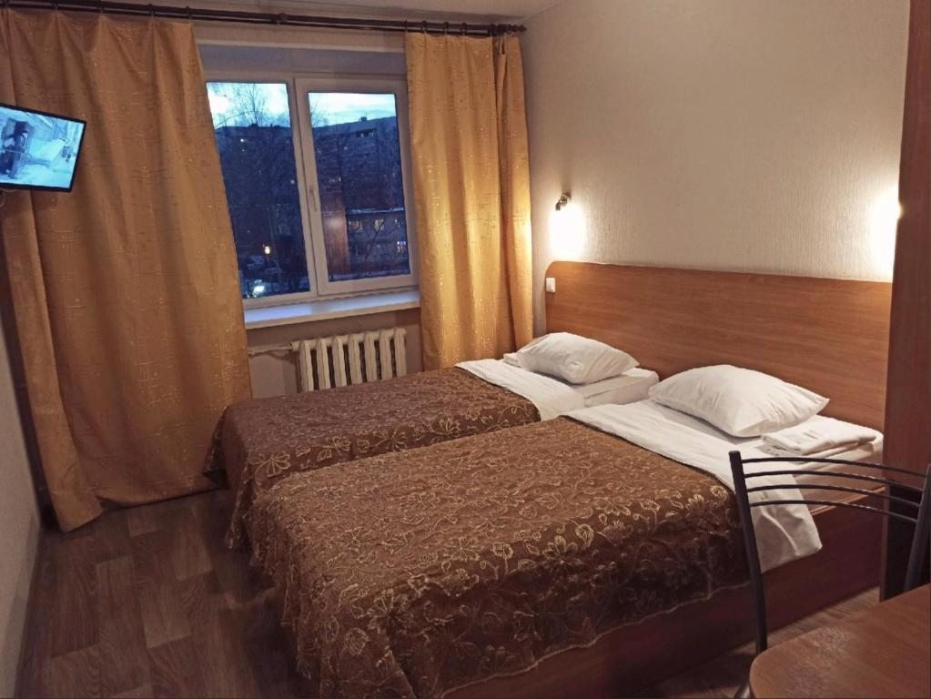 Двухместный (Двухместный номер с 2 отдельными кроватями и общей ванной комнатой) отеля Березовая роща, Петрозаводск