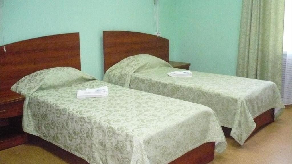 Двухместный (Двухместный номер с 2 отдельными кроватями и общей ванной комнатой) гостиницы Сияние Севера, Вельск