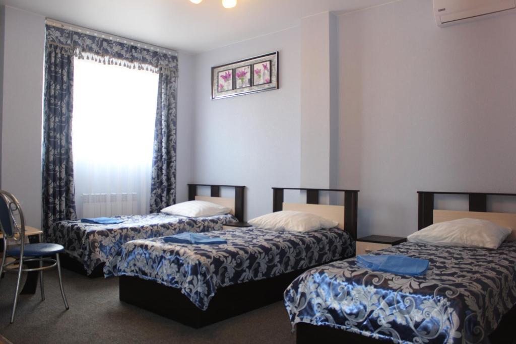 Номер (Односпальная кровать в общем мужском номере) отеля Оазис, Хабаровск