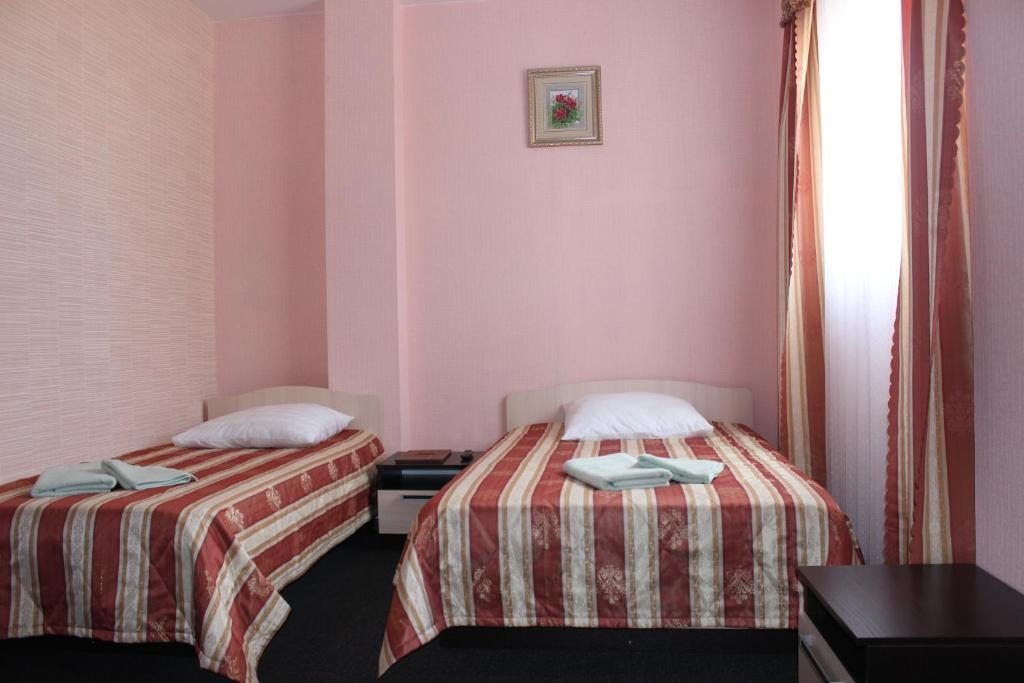 Номер (Односпальная кровать в общем номере для женщин) отеля Оазис, Хабаровск