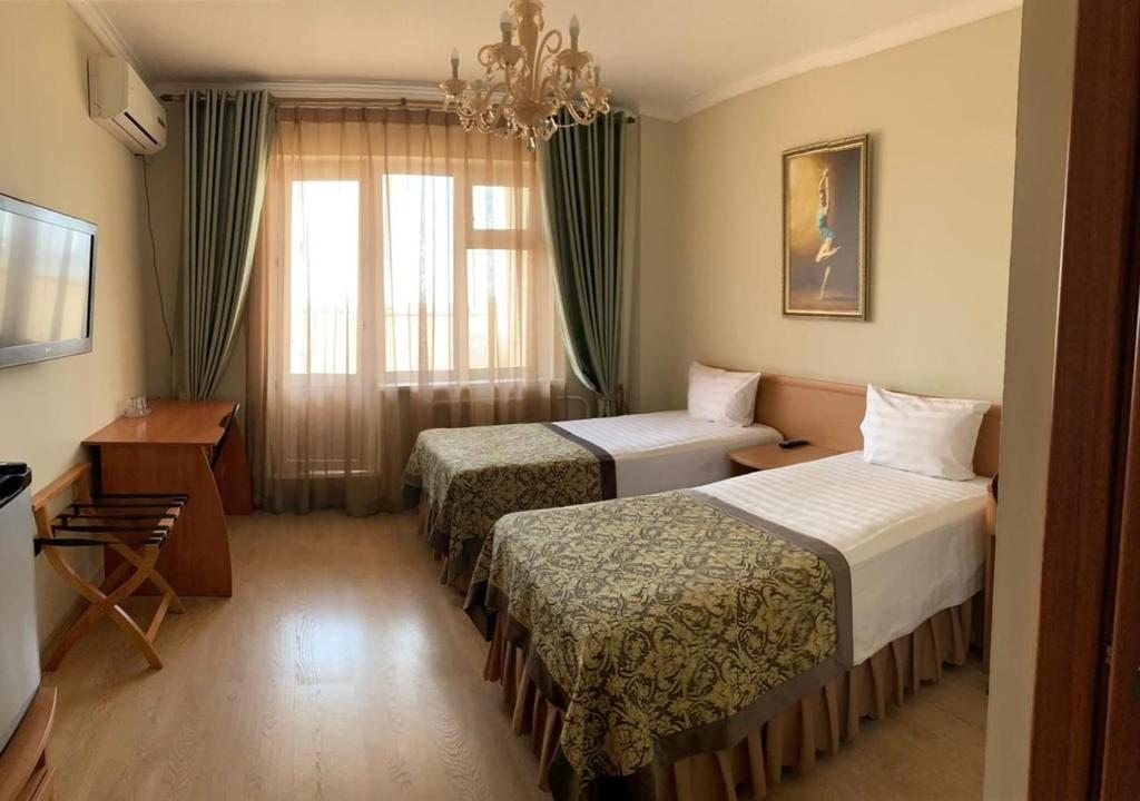 Двухместный (Стандартный двухместный номер с 2 отдельными кроватями) мини-отеля Браво, Якутск