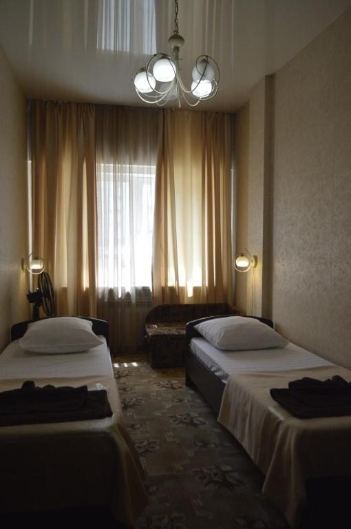 Двухместный (Двухместный номер с 2 отдельными кроватями) хостела Брусника, Иркутск