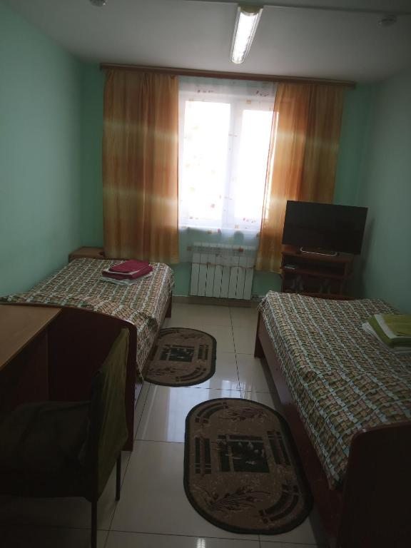 Номер (Односпальная кровать в общем номере для мужчин и женщин) хостела Vertices, Улан-Удэ