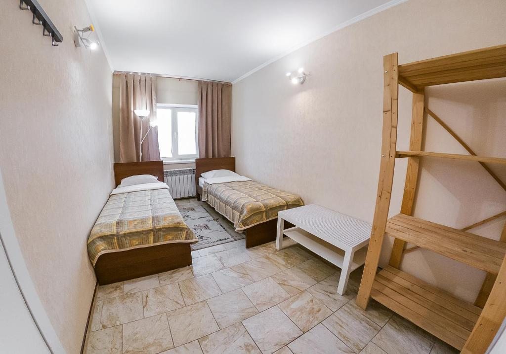 Двухместный (Бюджетный двухместный номер с 2 отдельными кроватями) отеля Malca, Шерегеш