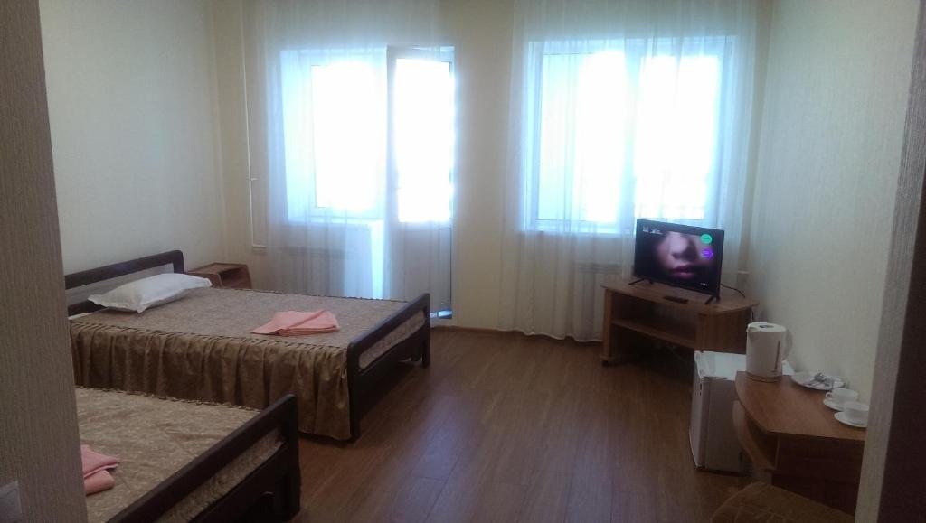 Двухместный (Стандартный двухместный номер с 2 отдельными кроватями и балконом) отеля Северный Байкал, Улан-Удэ