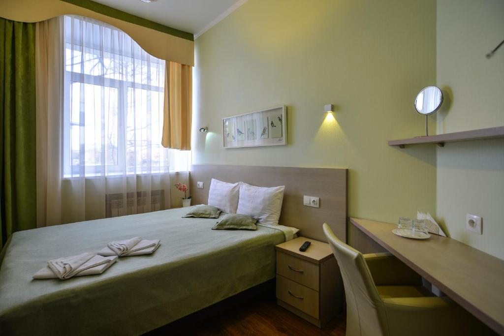 Двухместный (Бюджетный двухместный номер с 1 кроватью или 2 отдельными кроватями) мини-отеля Сова, Омск