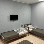 Стандартный четырехместный номер с ванной комнатой