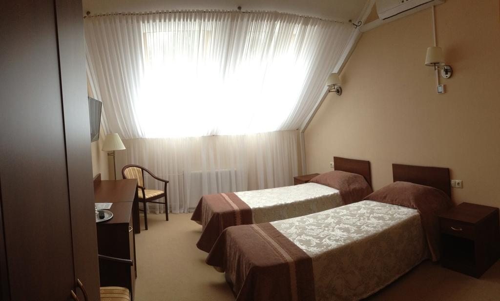 Двухместный (Стандартный двухместный номер с 2 отдельными кроватями) отеля Чайковский на Мира