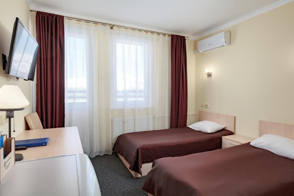 Двухместный (Стандартный двухместный номер с 2 отдельными кроватями) курортного отеля Манжерок