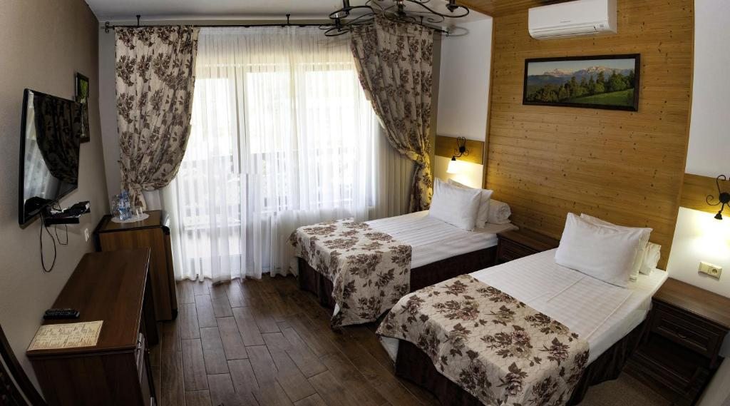 Двухместный (Двухместный номер с 2 отдельными кроватями и душем) гостевого дома Куршавель, Гуамка