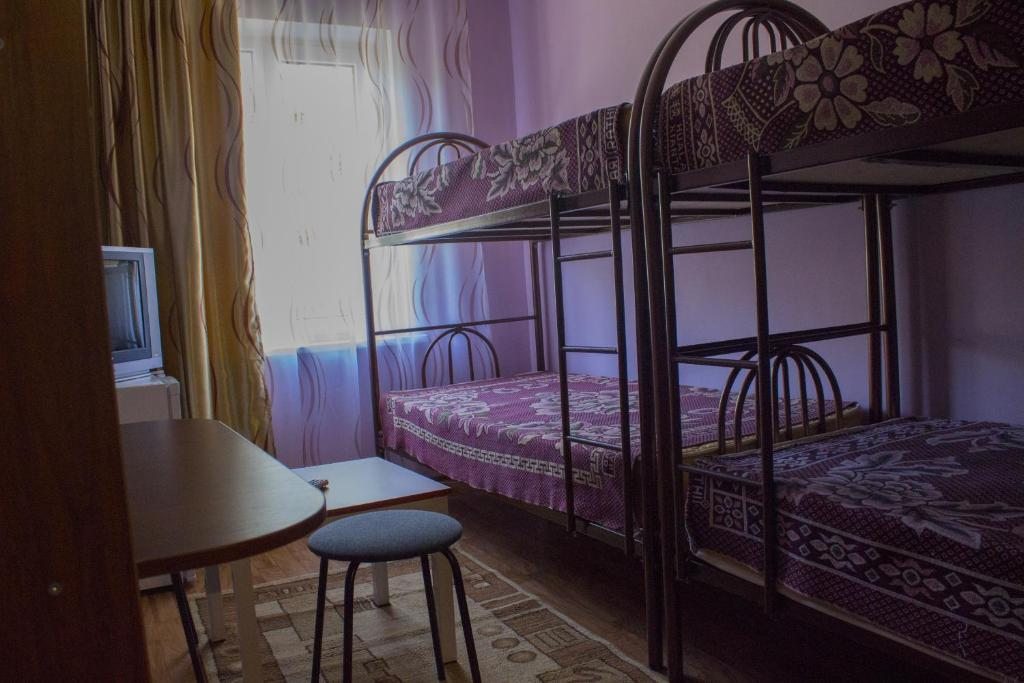 Номер (Односпальная кровать в общем номере с 4 кроватями) отеля Tahar, Алматы