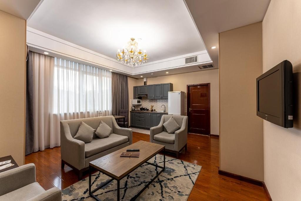 Апартаменты (Апартаменты с 1 спальней с 2 отдельными кроватями и гостиной) отеля Renion Residence Hotel, Алматы