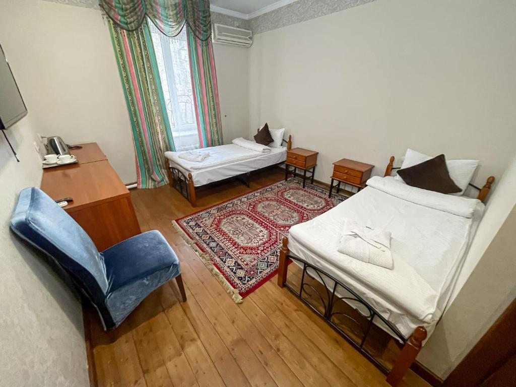 Двухместный (Двухместный номер с 2 отдельными кроватями) отеля Той-Дами, Алматы