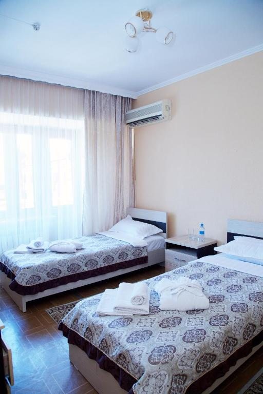 Двухместный (Стандартный двухместный номер с 1 кроватью или 2 отдельными кроватями) отеля Аксункар, Алматы