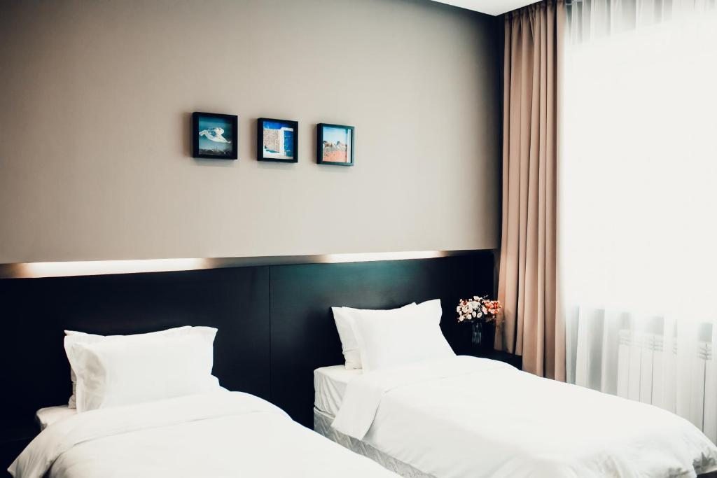 Двухместный (Большой двухместный номер с 1 кроватью или 2 отдельными кроватями) отеля Астана Централ