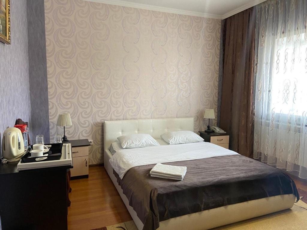 Двухместный (Просторный двухместный номер с 2 отдельными кроватями) отеля Пульсар, Астана