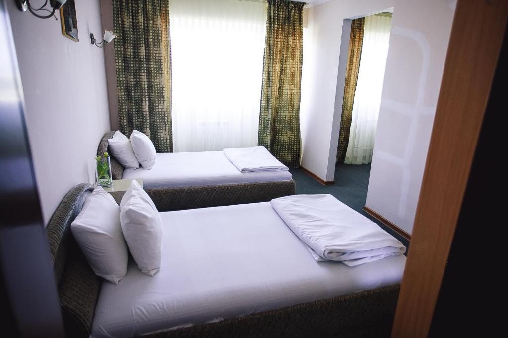 Двухместный (Двухместный номер с 2 отдельными кроватями) отеля Актау