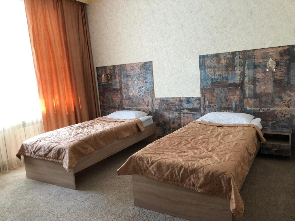Двухместный (Просторный двухместный номер с 2 отдельными кроватями) отеля Flamingo, Актобе