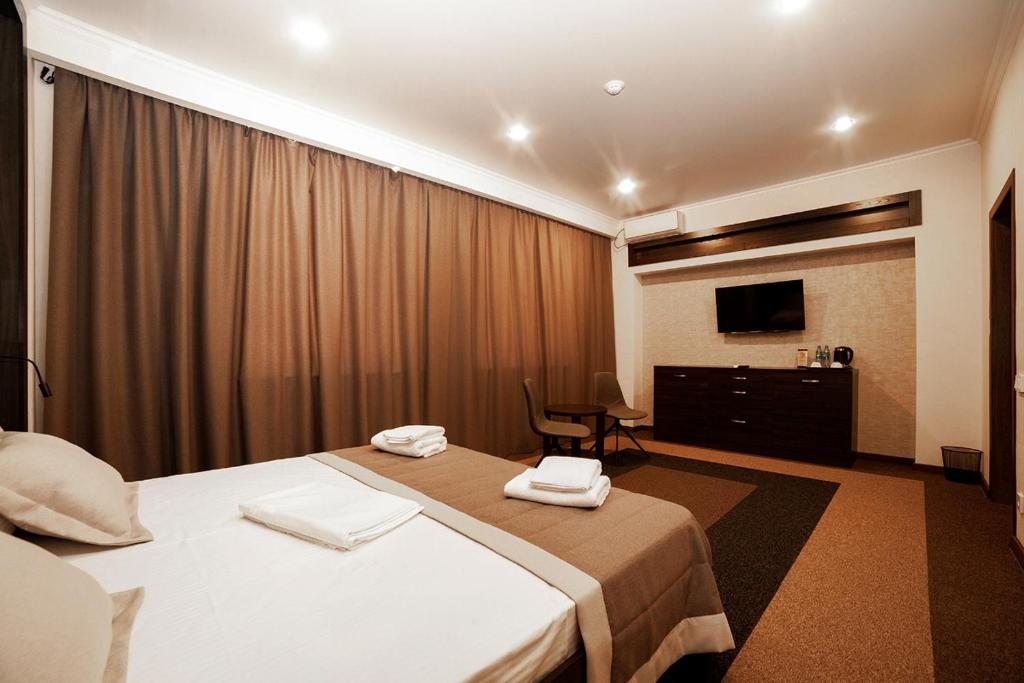 Двухместный (Большой двухместный номер с 1 кроватью или 2 отдельными кроватями) отеля Меридиан, Караганда