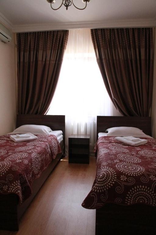 Двухместный (Двухместный номер с 2 отдельными кроватями и ванной комнатой) отеля Satti, Жаркент