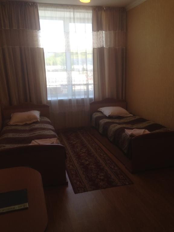 Двухместный (Небольшой двухместный номер с 2 отдельными кроватями) отеля Altay, Риддер
