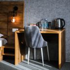 De Luxe (Де Люкс), Гостиница Олимп