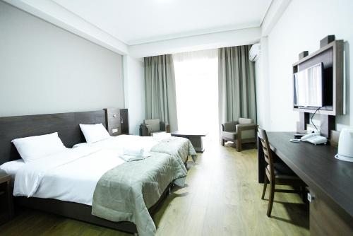 Двухместный (Большой двухместный номер с 2 отдельными кроватями) отеля Colombi, Тбилиси