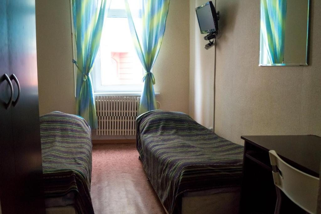 Двухместный (Двухместный номер с 2 отдельными кроватями и общей ванной комнатой) хостела Апельсин, Ульяновск