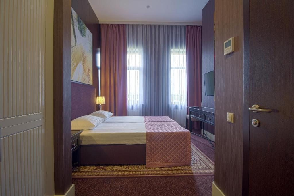 Двухместный (Стандартный двухместный номер с 1 кроватью или 2 отдельными кроватями) мини-отеля Юдино Парк