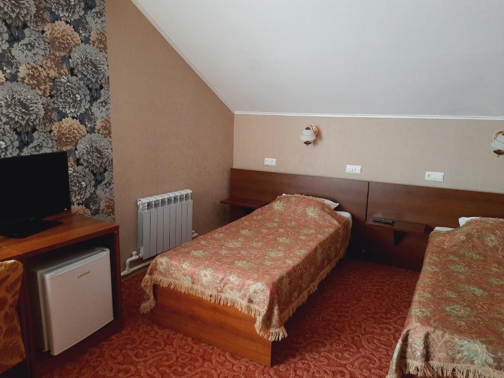 Двухместный (Стандартный двухместный номер с 2 отдельными кроватями) отеля Тирольский, Шерегеш