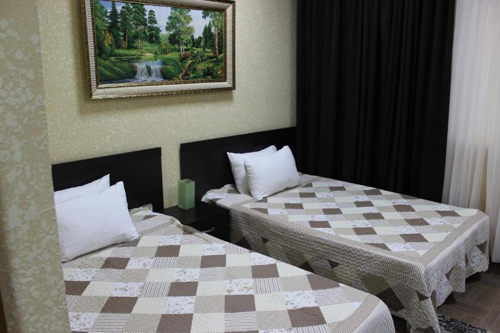 Апартаменты (Четырехместный двухкомнатный номер с раздельными кроватями) гостиницы Green House, Железноводск