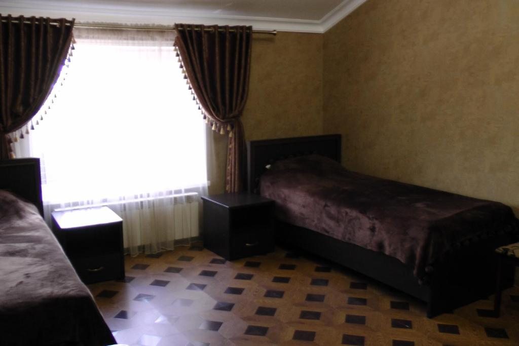 Двухместный (Бюджетный двухместный номер с 2 отдельными кроватями) отеля Империя, Кизляр