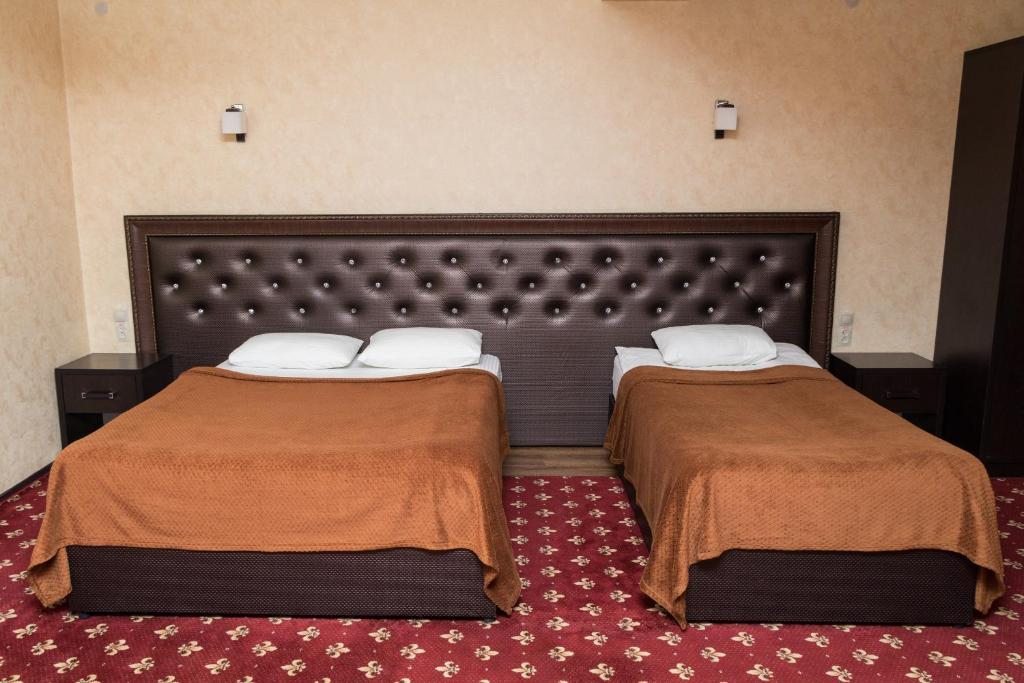 Двухместный (Двухместный номер Делюкс с 1 кроватью или 2 отдельными кроватями, вид на город) отеля Фламинго, Хасавюрт