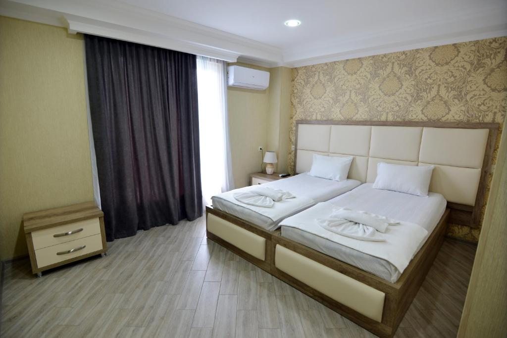 Двухместный (Двухместный номер с 1 кроватью или 2 отдельными кроватями и ванной комнатой) гостевого дома Nuciko, Кутаиси
