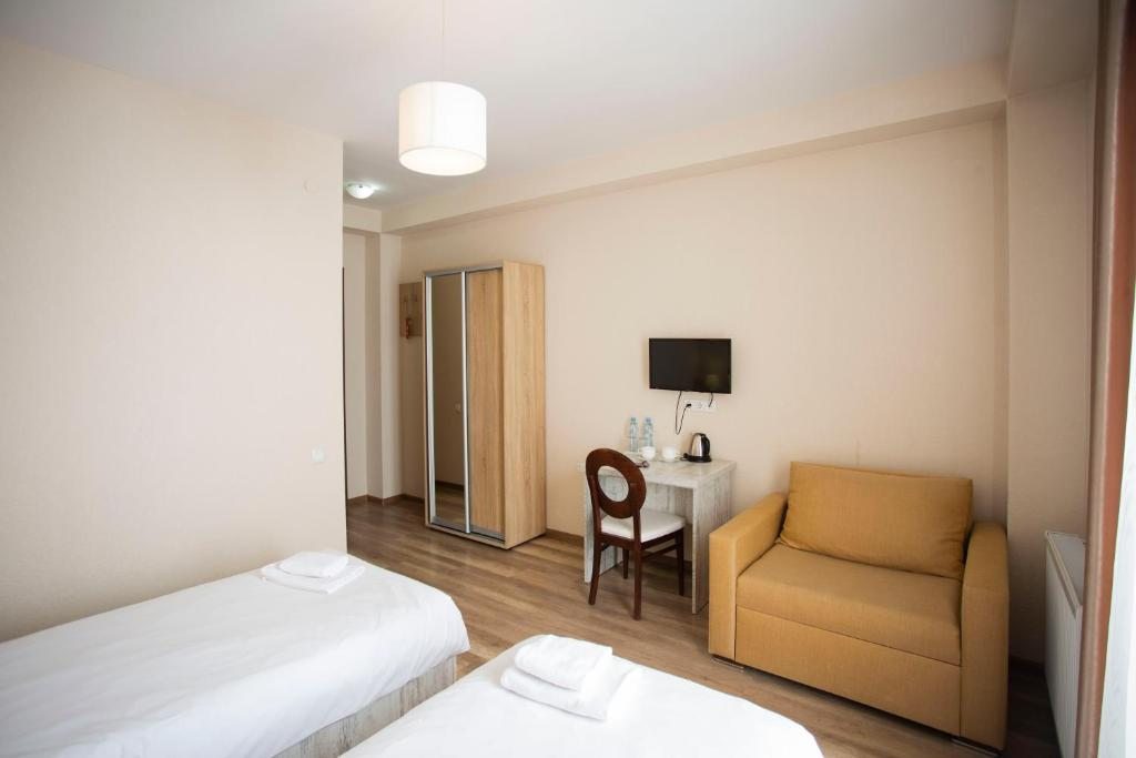 Двухместный (Двухместный номер с 2 отдельными кроватями и видом на горы) отеля Donata, Гудаури