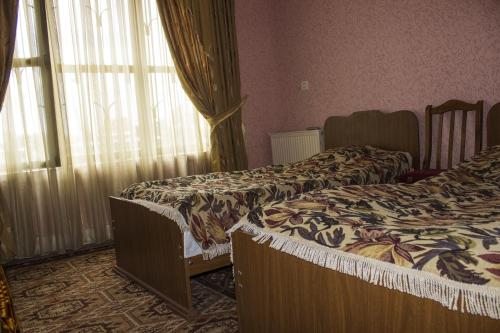 Двухместный (Двухместный номер с 2 отдельными кроватями и ванной комнатой) гостевого дома Кавкасиони 33, Телави