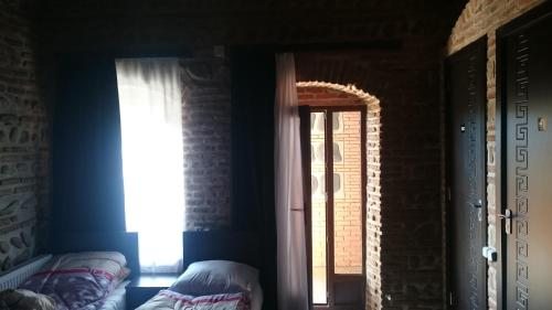 Двухместный (Двухместный номер с 1 кроватью или 2 отдельными кроватями и cобственной внешней ванной комнатой) отеля Старый дом в Сигнахи
