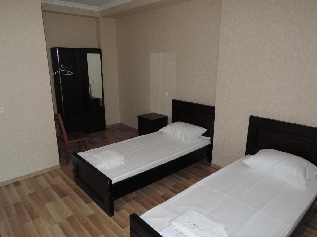 Двухместный (Двухместный номер с 2 отдельными кроватями и собственной ванной комнатой) отеля Погреб Шалошвили, Шилда