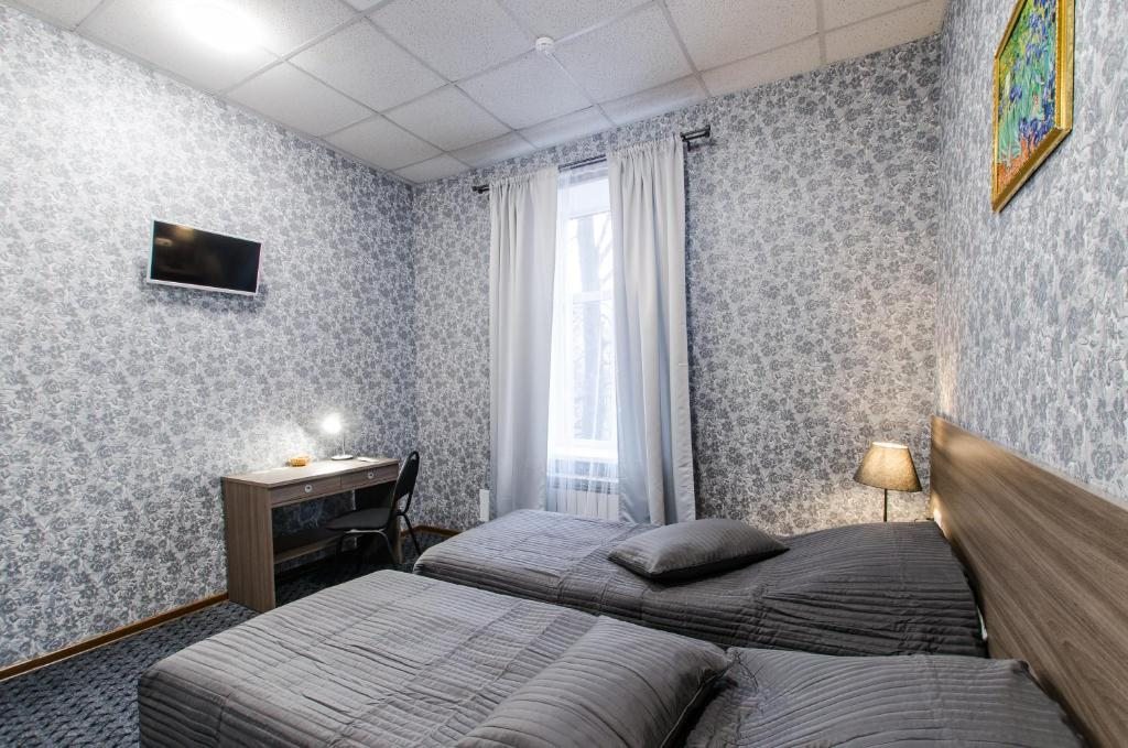 Двухместный (Двухместный номер с 2 отдельными кроватями и общей ванной комнатой) отеля 338 Отель на Мира, Санкт-Петербург