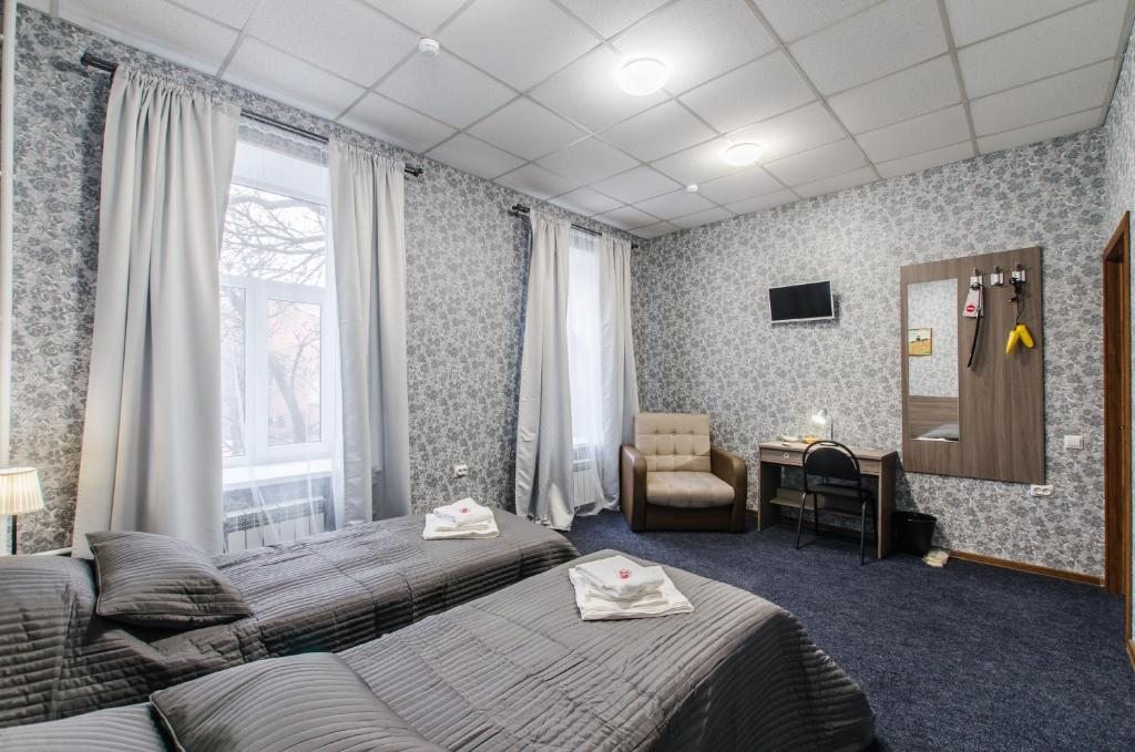 Двухместный (Стандартный двухместный номер с 2 отдельными кроватями и общей ванной комнатой) отеля 338 Отель на Мира, Санкт-Петербург