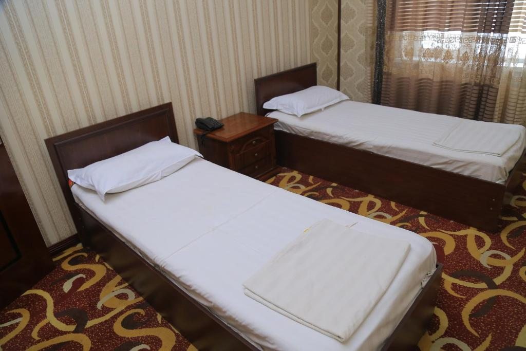 Двухместный (Улучшенный двухместный номер с 1 кроватью или 2 отдельными кроватями) отеля Дангара, Коканд