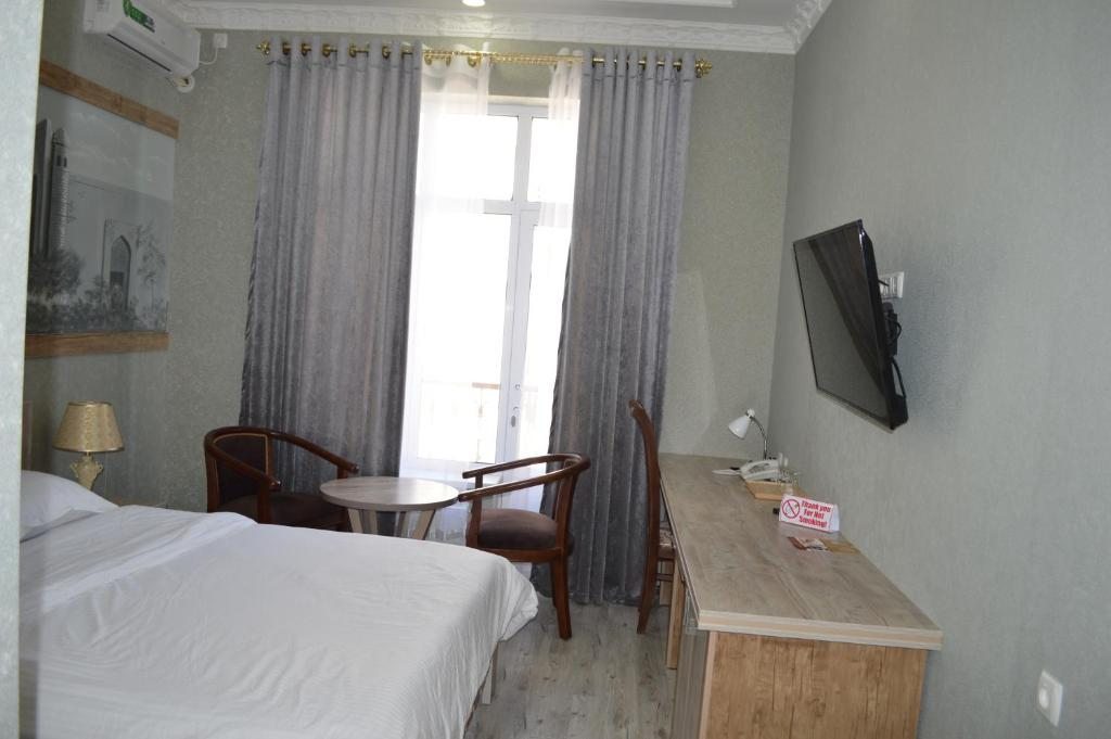 Двухместный (Улучшенный двухместный номер с 2 двуспальными кроватями) отеля Ideal, Самарканд