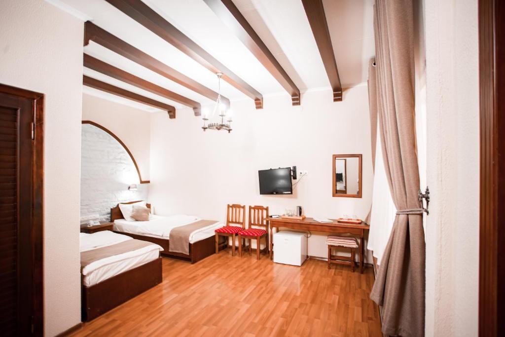 Двухместный (Улучшенный двухместный номер с 2 отдельными кроватями) отеля Малика Бухара