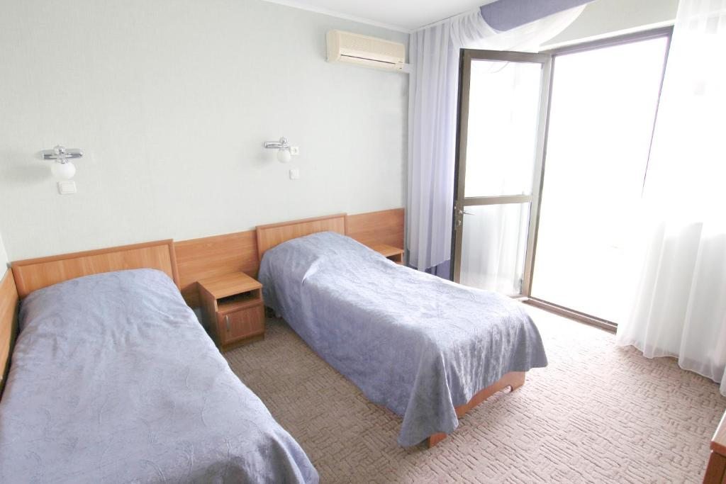Двухместный (Стандартный двухместный номер с 2 отдельными кроватями и видом на море) санатория Магадан, Лоо